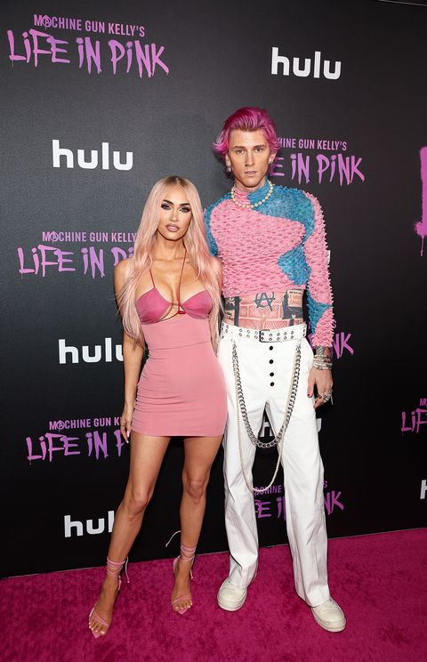 megan fox in a pink minidress and machine gun kelly in a popcorn top and white pants