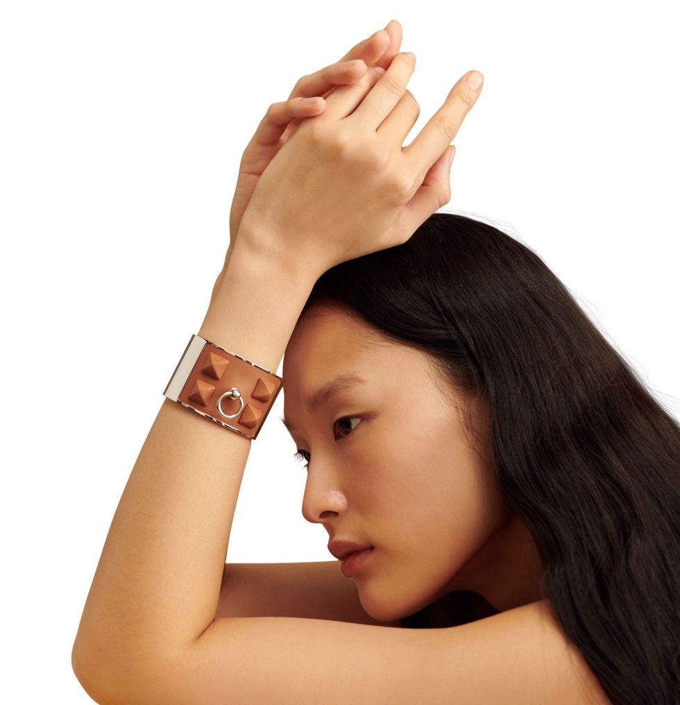 a woman with her hand on her head