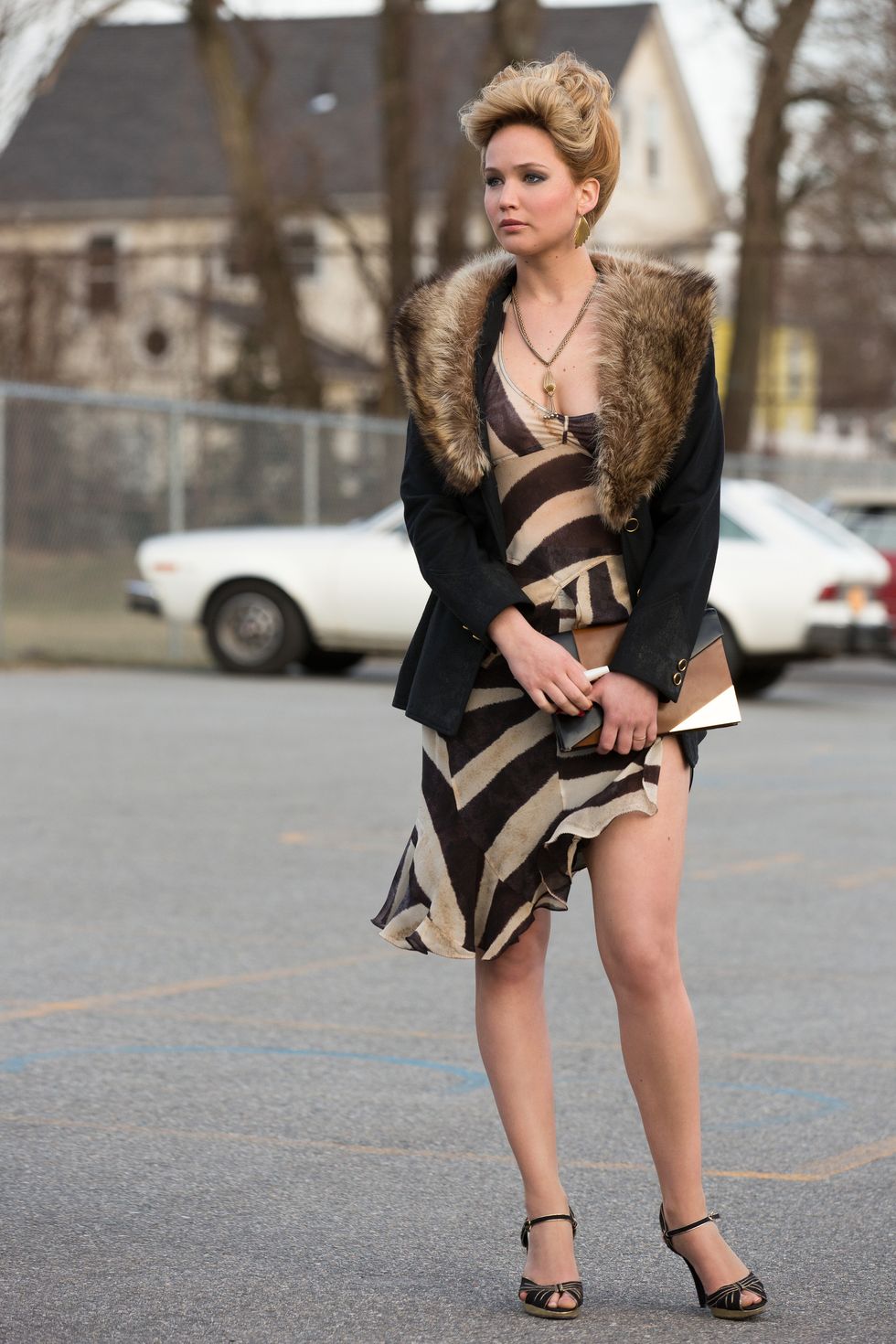 a blonde woman in a dress and high heels