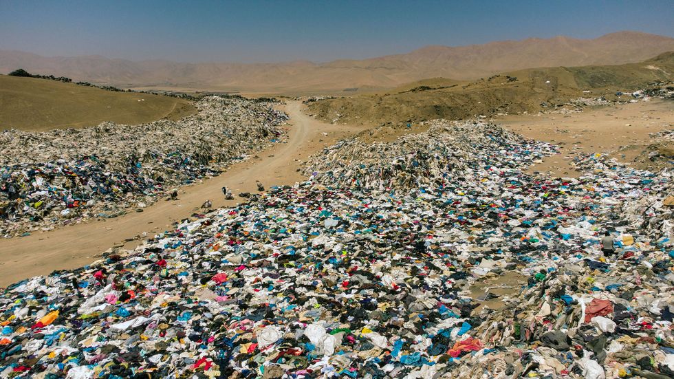 view of used clothes discarded in the atacama desert in alto hospicio iquique chile