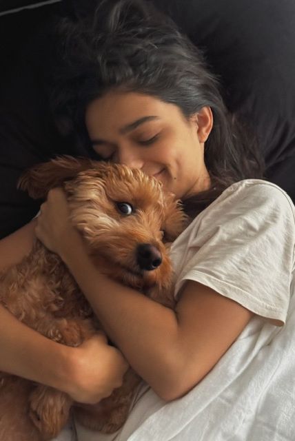 a person sleeping with a dog