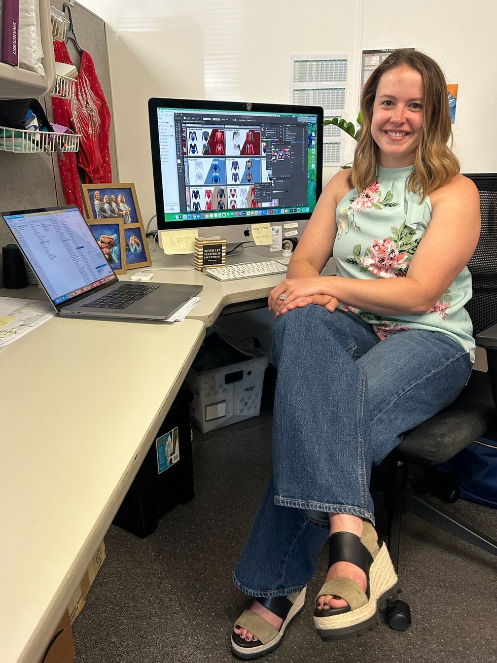 a person sitting in front of a computer