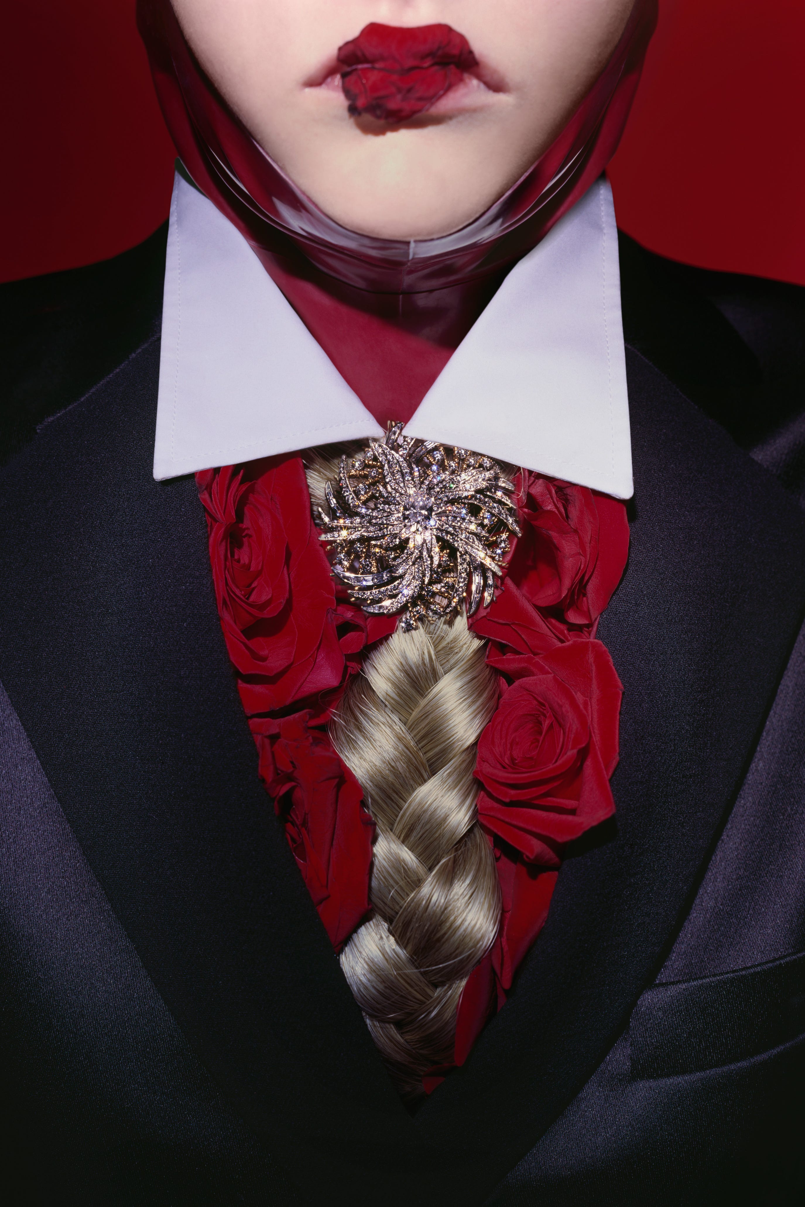 a close up shot of a woman with a tie made of braided human hair