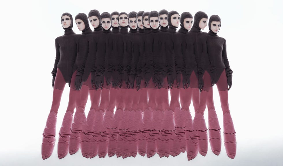 a group of models in hooded black and pink ensembles