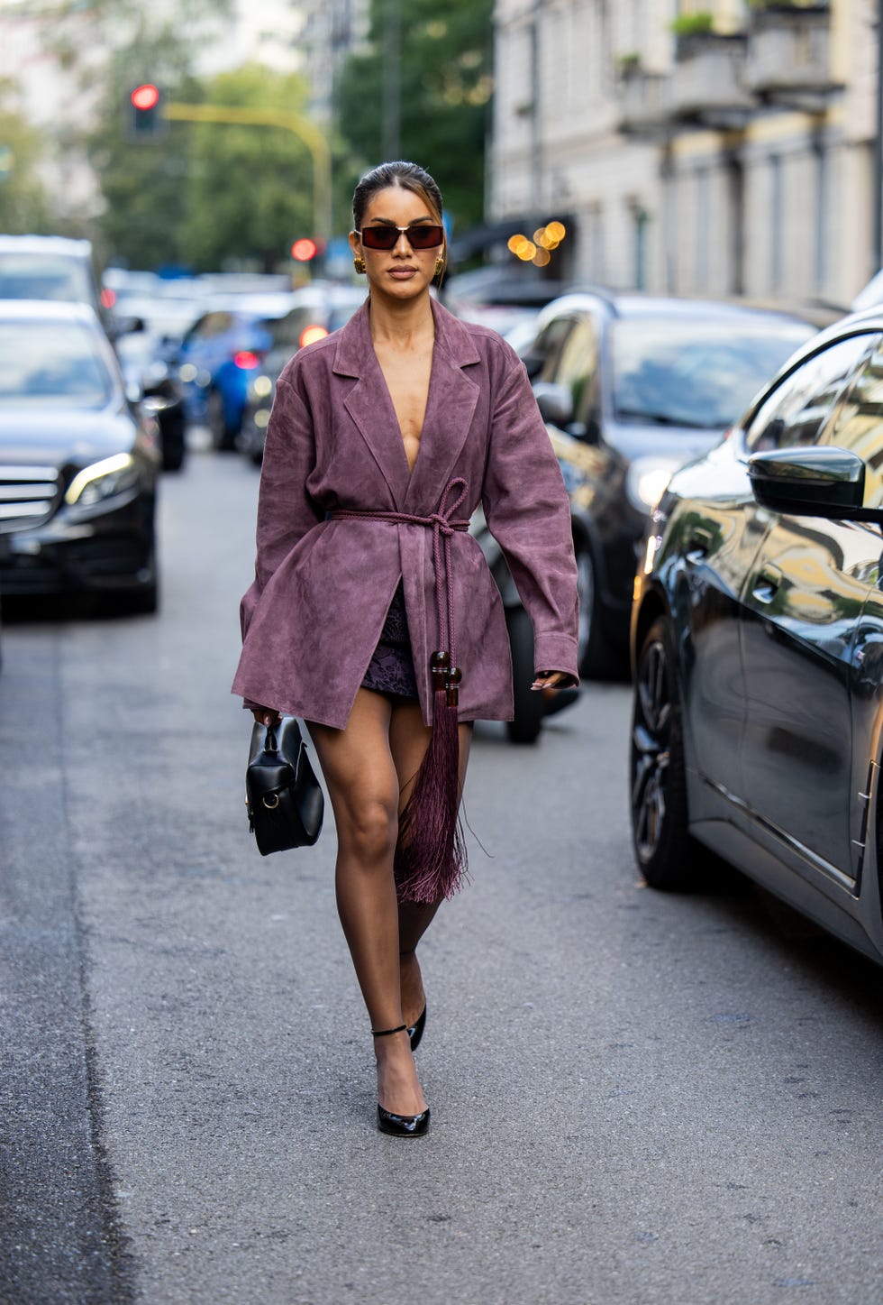 milan, italy september 19 camila coelho wears purple belted jacket, black bag outside max mara during the milan fashion week menswear springsummer 2025 on september 19, 2024 in milan, italy photo by christian vieriggetty images