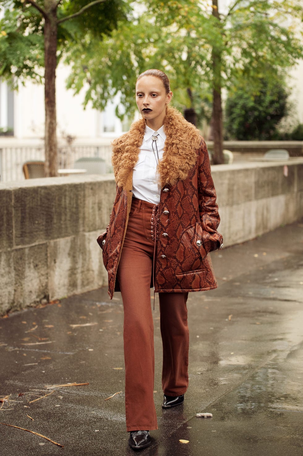 paris, france september 25 marie gaguech wears brown pants, white shirt, metal accessory tie, brown leather coat with fur collar outside the paco rabanne show during womenswear springsummer 2025 as part of paris fashion week on september 25, 2024 in paris, france photo by raimonda kulikauskienegetty images