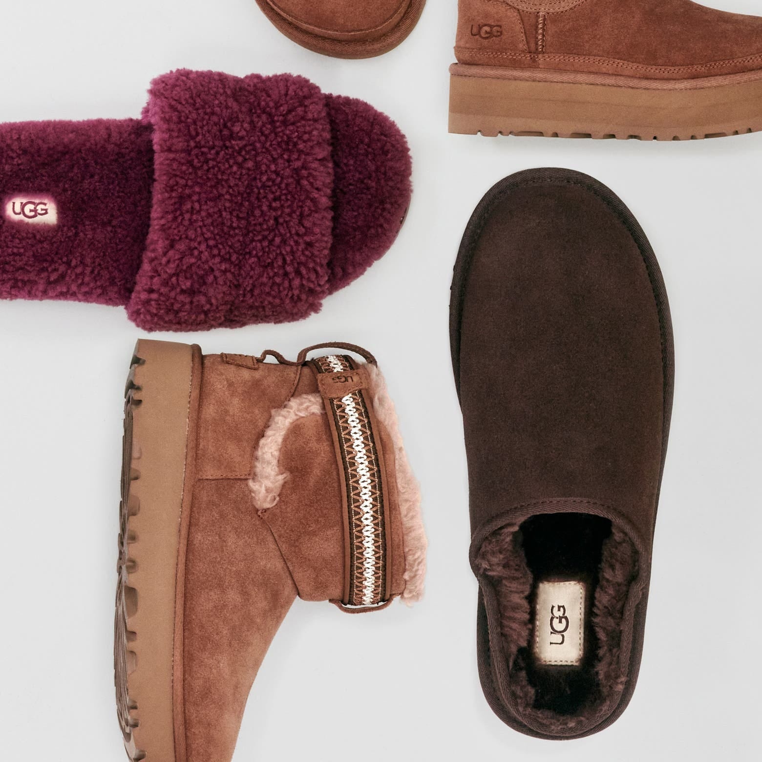 collection of ugg footwear arranged on a light background