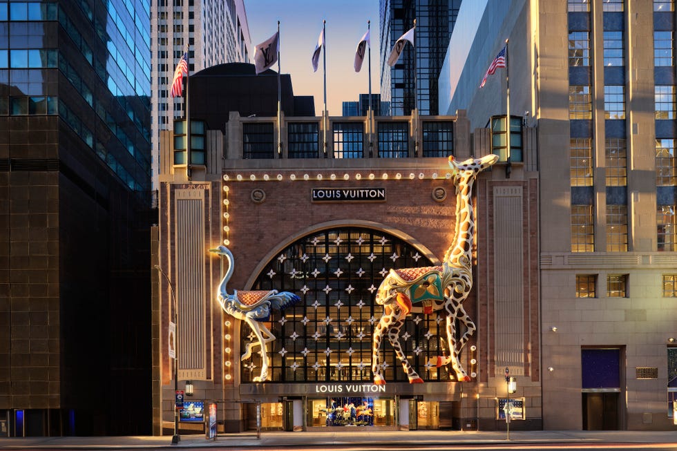 facade of a louis vuitton store featuring oversized animal sculptures